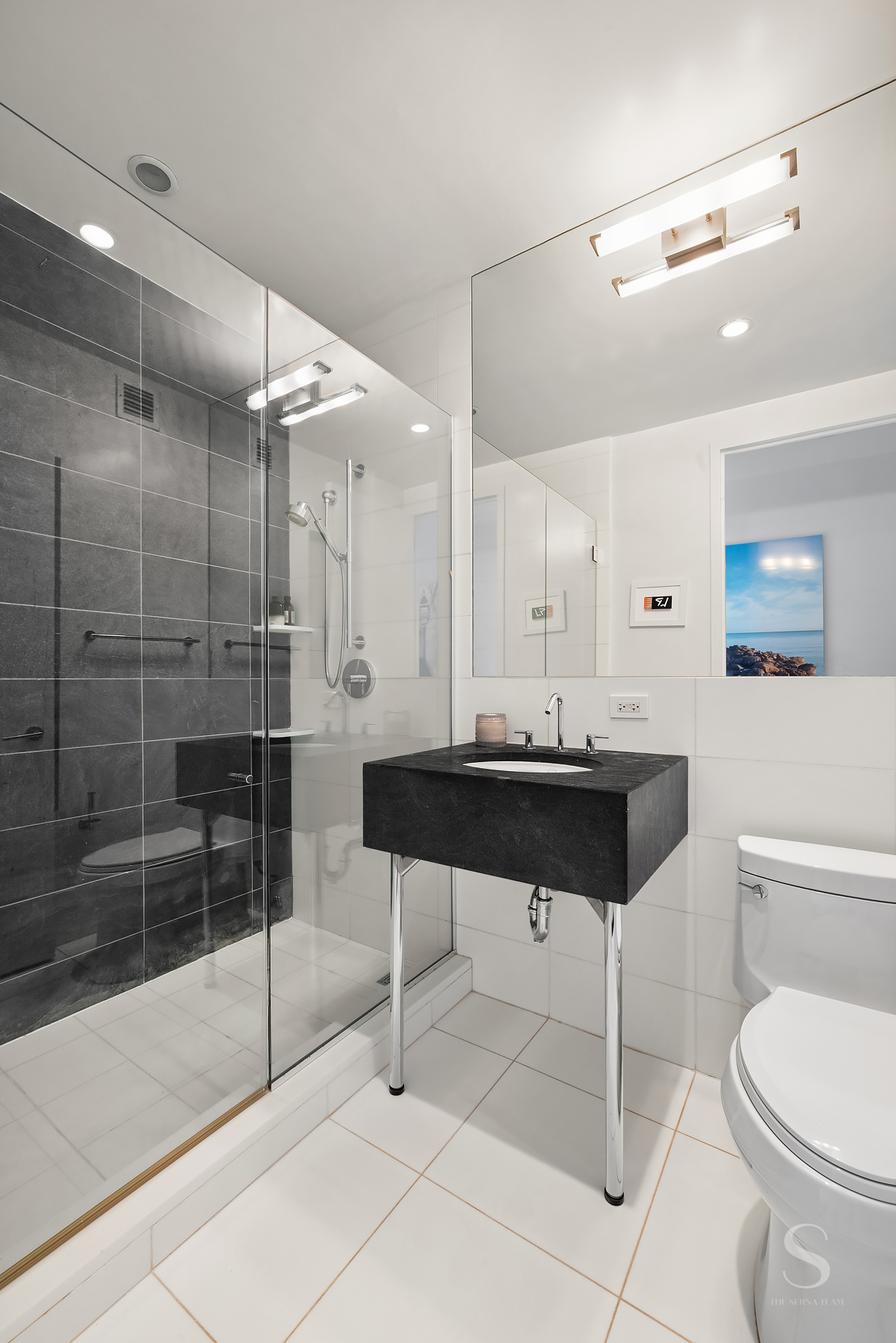 4 West 21st Street, Unit 14A Manhattan, NY 10010 - Photo 10 of 16 a bathroom with a toilet a sink and a shower