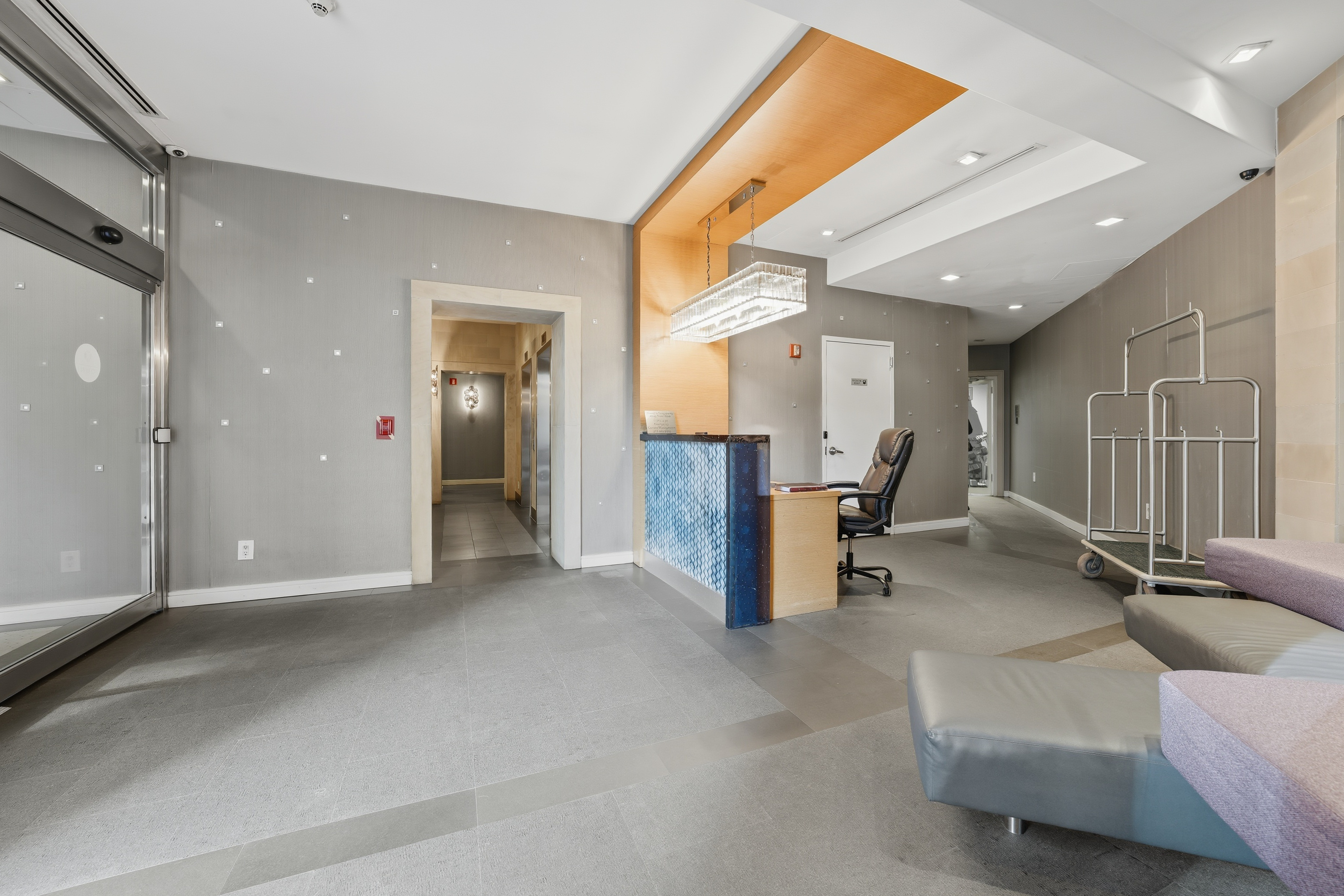 206 East 95th Street, Unit 6B Manhattan, NY 10128 - Photo 19 of 25 a view of a livingroom with furniture and a window