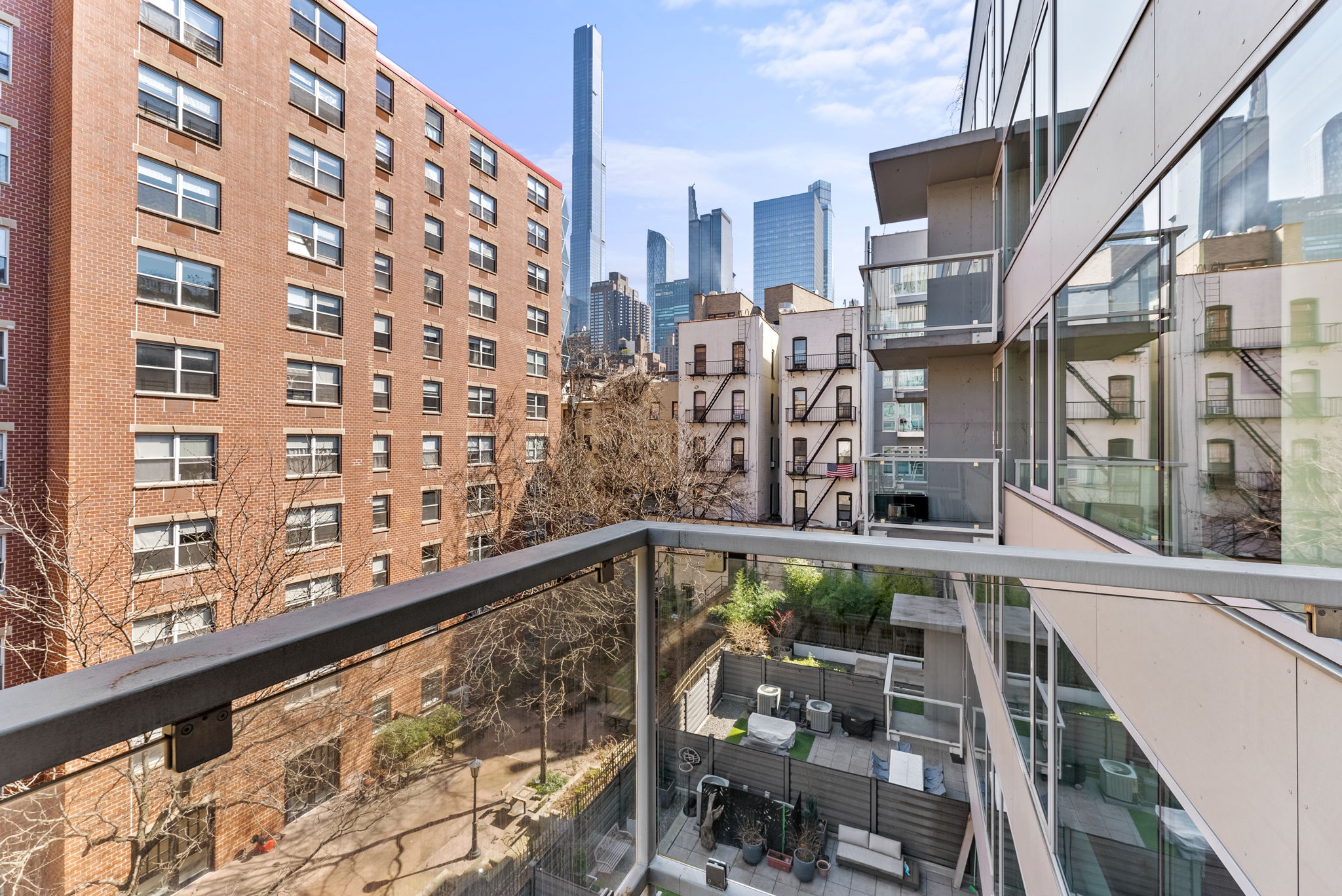 425 West 53rd Street, Unit 416 Manhattan, NY 10019 - Photo 9 of 19 a view of a balcony with chairs