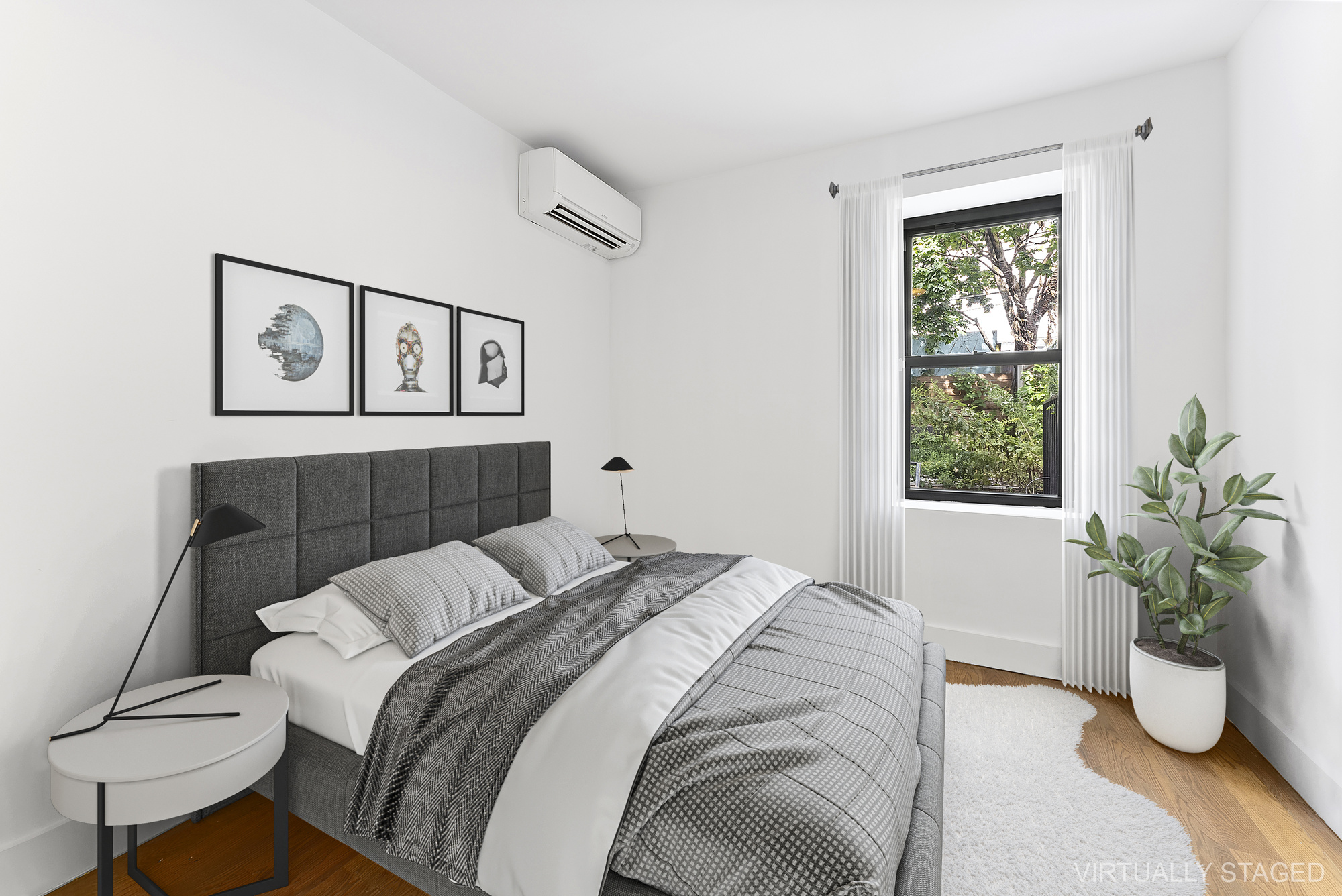 81 Eldert Street, Unit 1 Brooklyn, NY 11207 - Photo 5 of 9 a bedroom with a bed and a potted plant