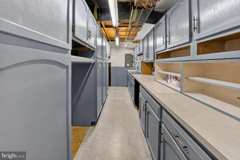 a kitchen with stainless steel appliances granite countertop a refrigerator and a stove