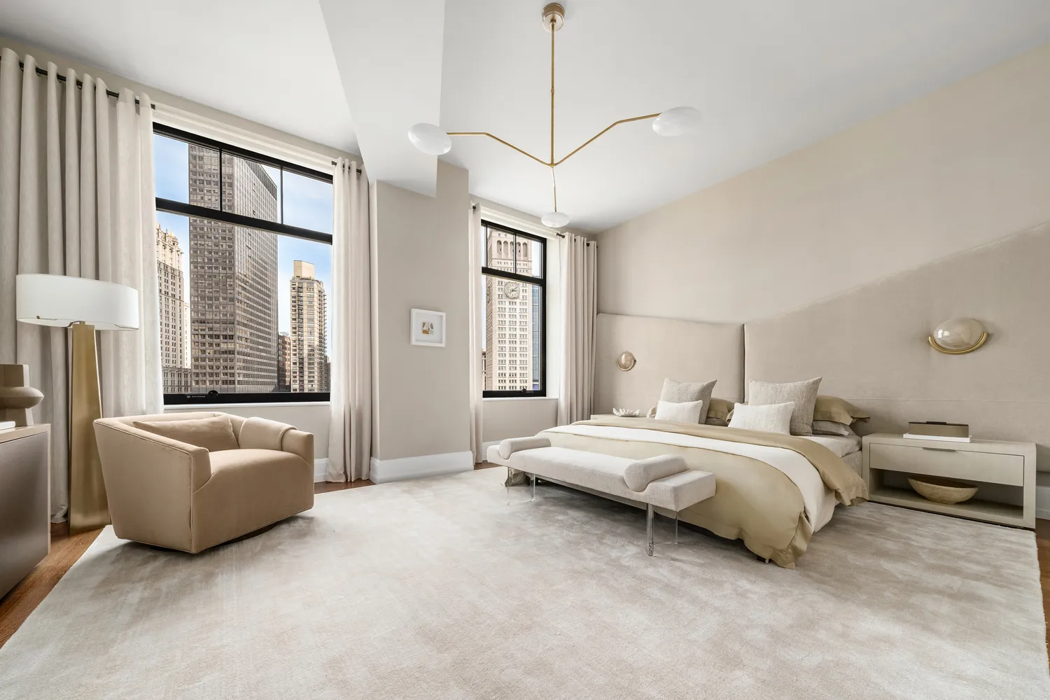 a spacious bedroom with a bed and a couch