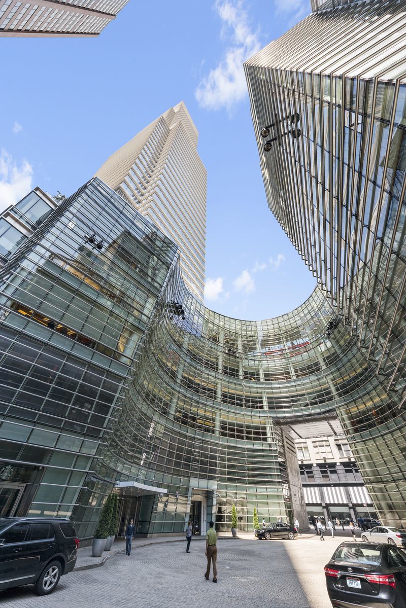 151 East 58th Street, Unit 39D Manhattan, NY 10022 - Photo 11 of 12 a view of parking area with parked cars