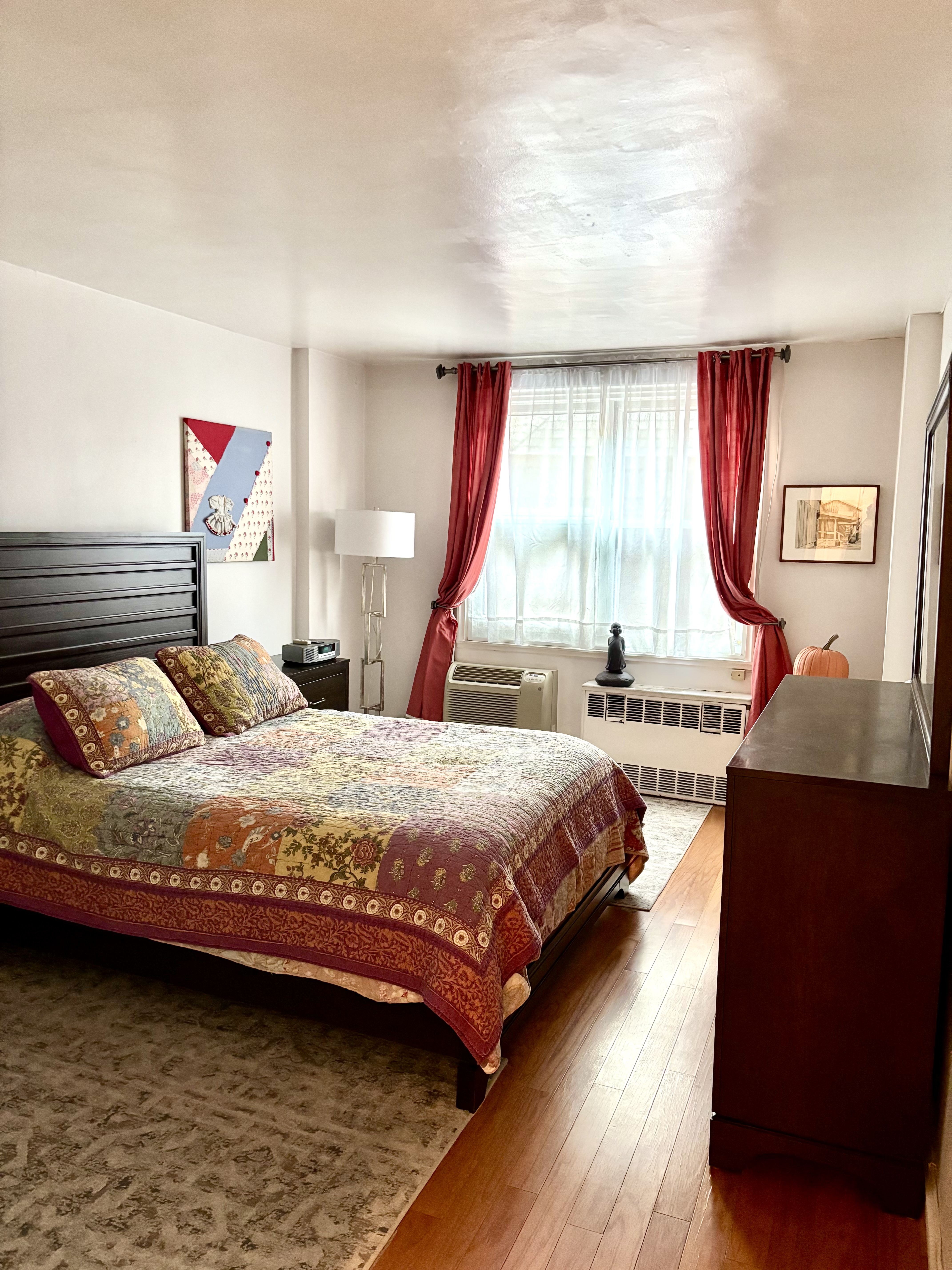 1270 5th Avenue, Unit 3B Manhattan, NY 10029 - Photo 3 of 7 a bedroom with a bed and window