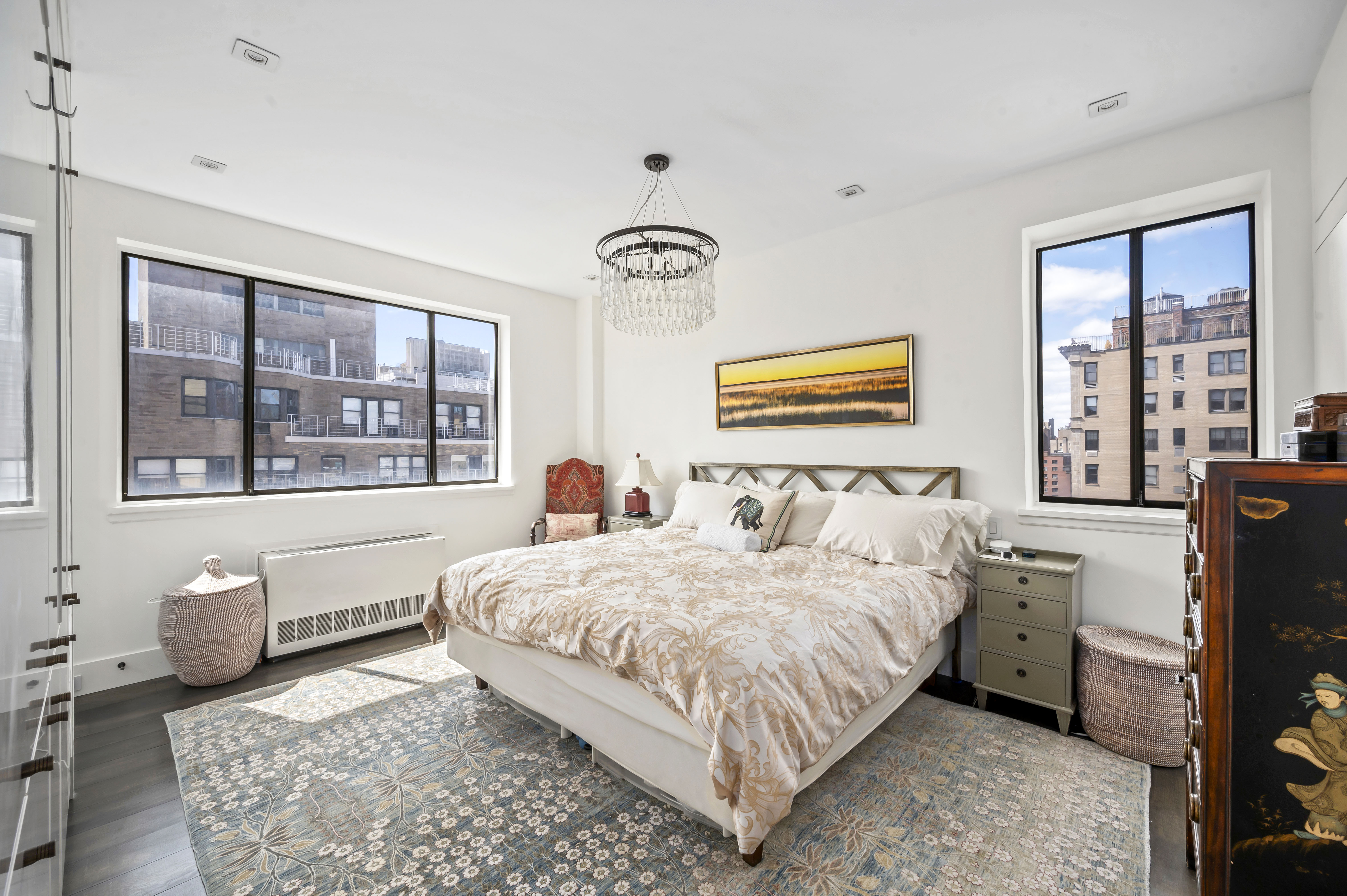 131 East 81st Street, Unit PH15 Manhattan, NY 10028 - Photo 8 of 11 a bedroom with a bed and glass window