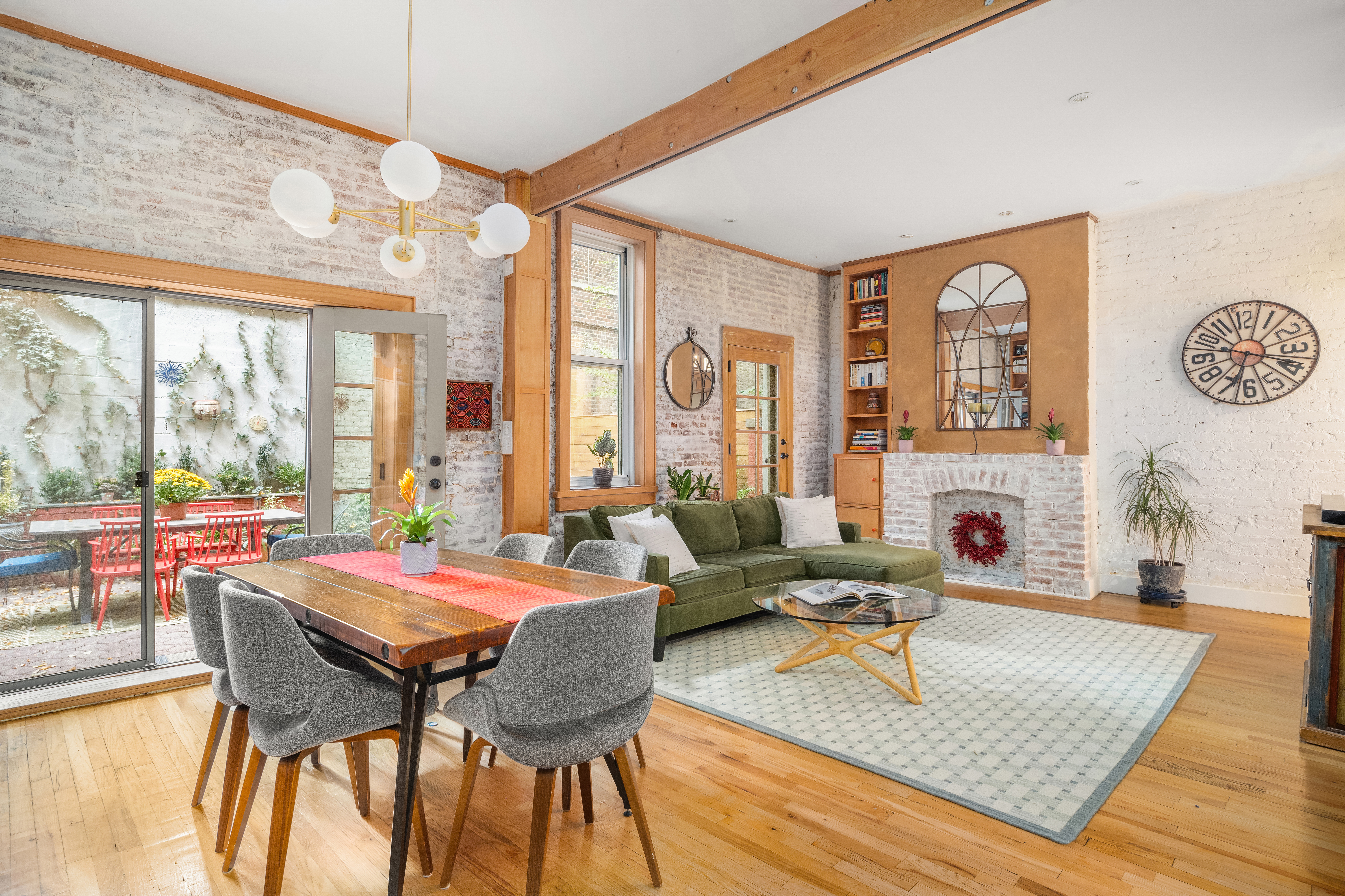 92 Horatio Street, Unit 1J Manhattan, NY 10014 - Photo 1 of 16 a living room with furniture and a large window