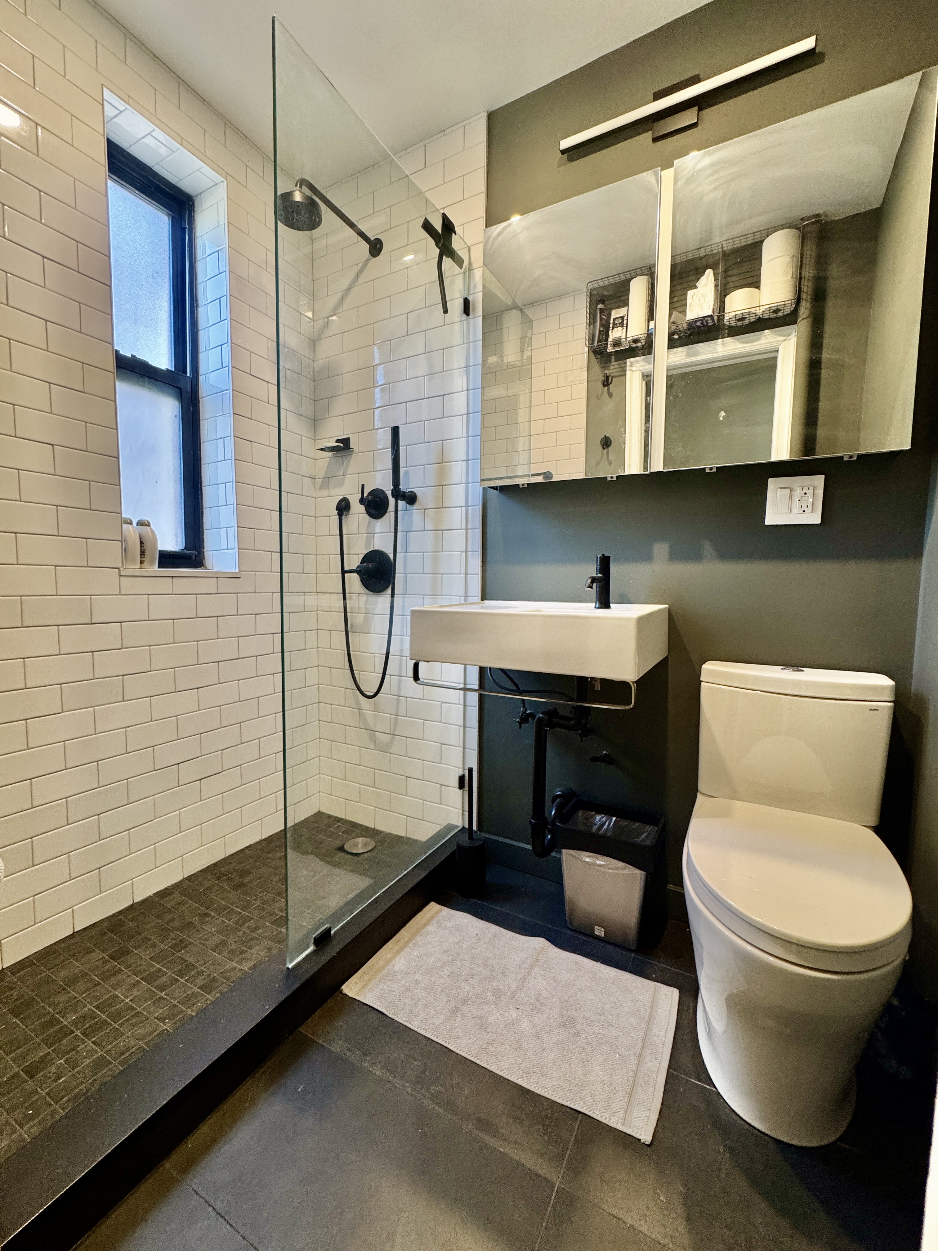 90 Park Terrace East, Unit 3B Manhattan, NY 10034 - Photo 3 of 13 a bathroom with a sink toilet and shower