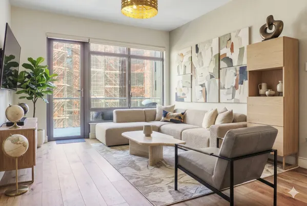 a living room with furniture and a window