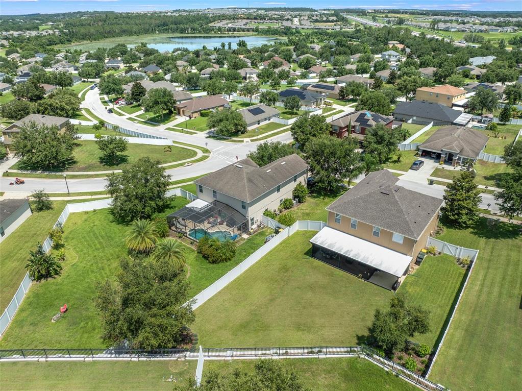 352 Giovani Boulevard Clermont, FL 34715 - Photo 35 of 46 an aerial view of residential houses with outdoor space and parking