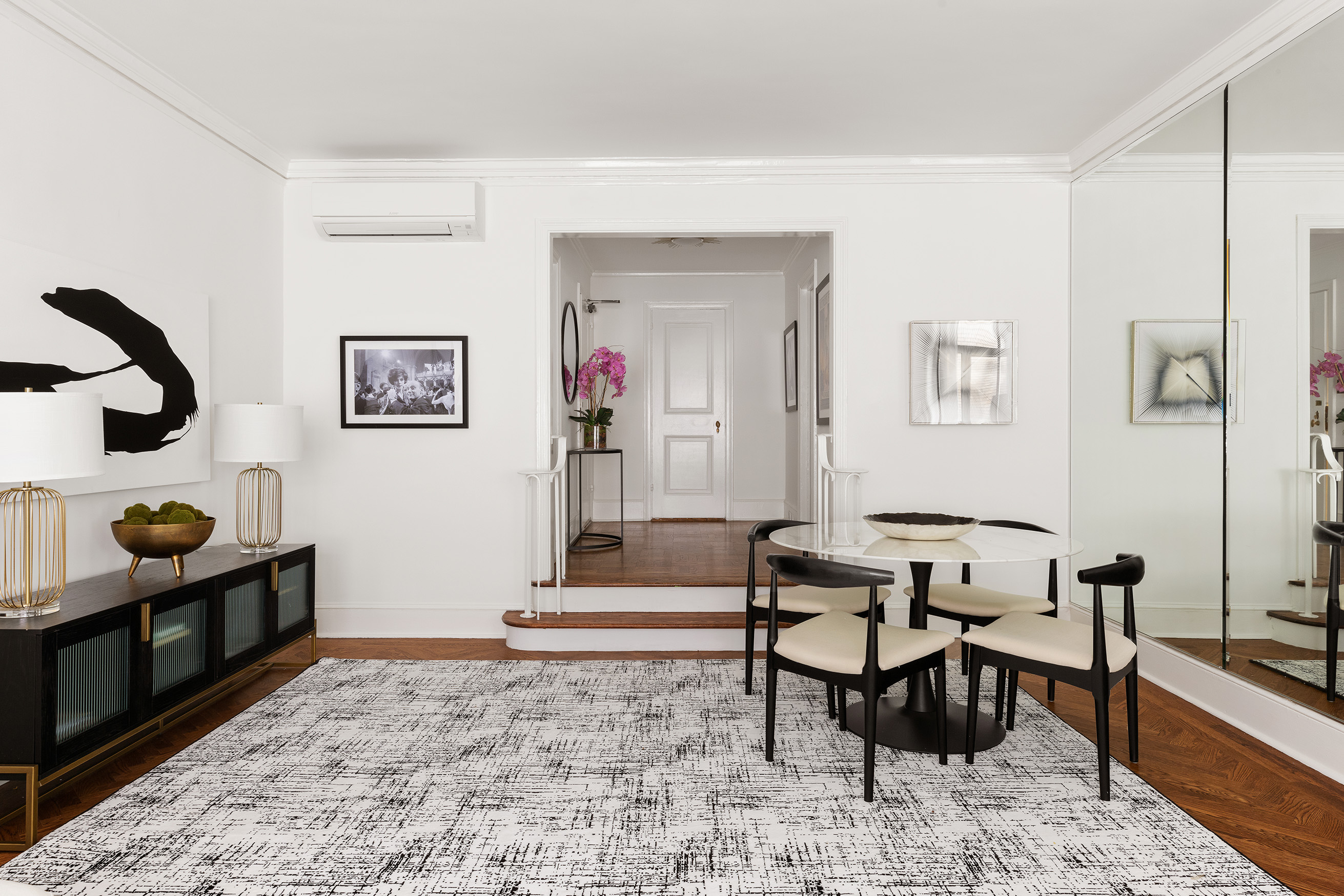 150 Central Park South, Unit 1010 Manhattan, NY 10019 - Photo 3 of 9 a living room with furniture and wooden floor