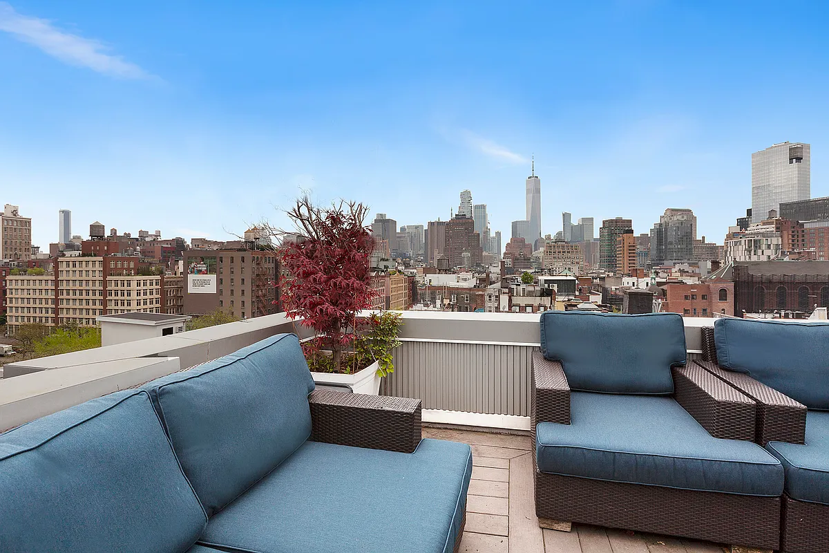 184 Thompson Street, Unit 6D Manhattan, NY 10012 - Photo 5 of 7 a view of roof deck with outdoor seating and city view