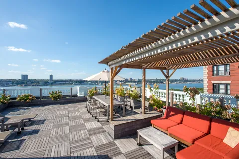a living room with furniture and pool table
