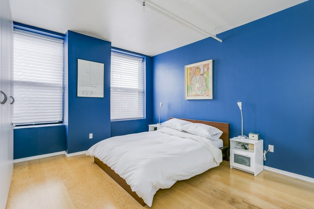 453 Washington Street, Unit 5D Boston, MA 02111 - Photo 9 of 17 a bedroom with a bed and a window