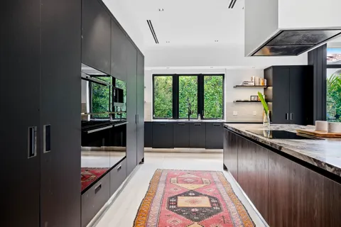 a living room with furniture a fireplace and a table