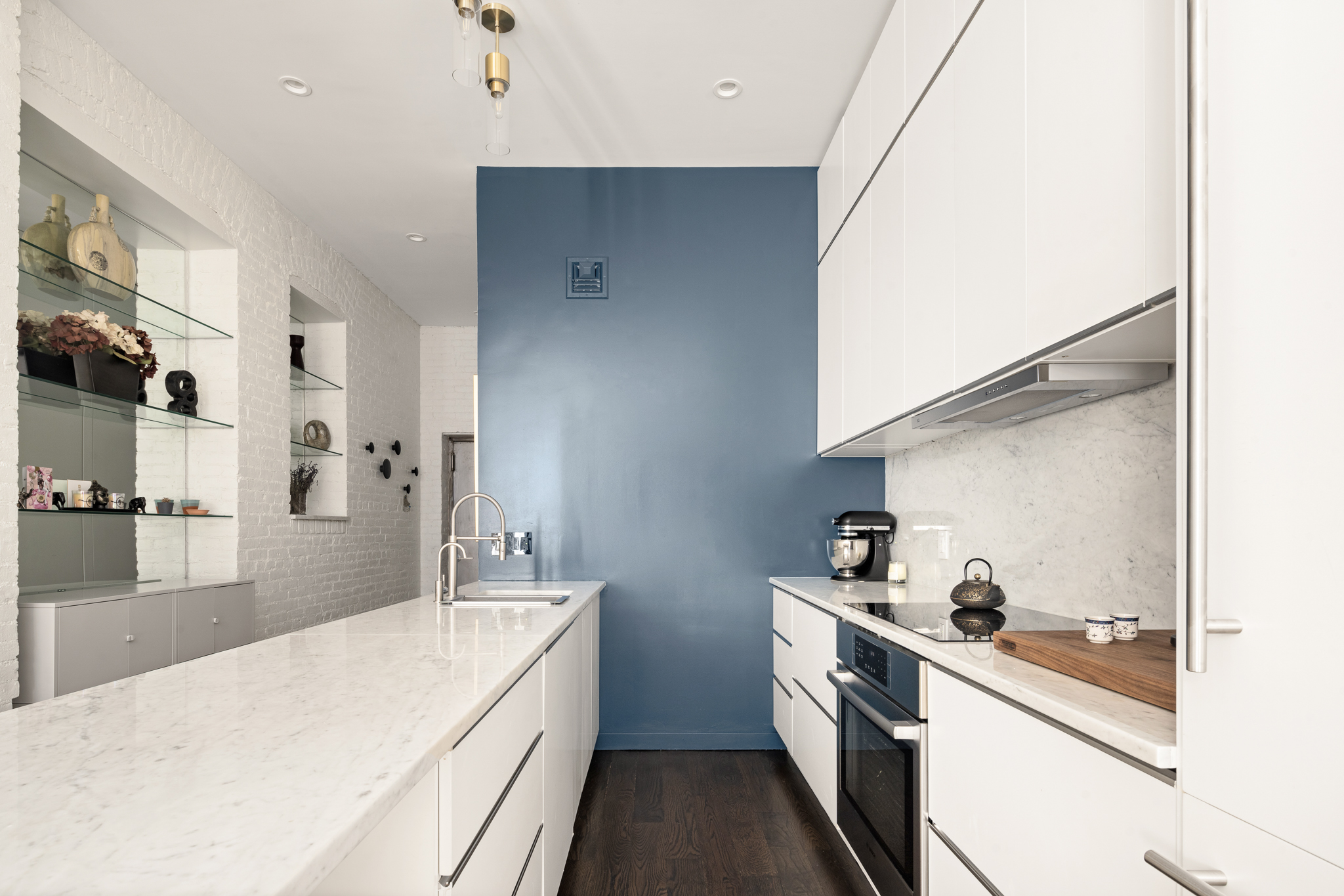 23 East 10th Street, Unit 508 Manhattan, NY 10003 - Photo 2 of 21 a kitchen with white cabinets and white appliances