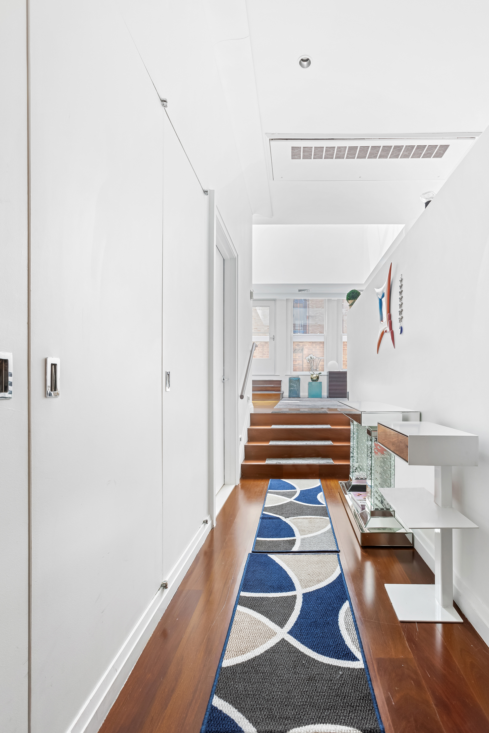 55 Wall Street, Unit PH942 Manhattan, NY 10005 - Photo 7 of 9 a walk in closet with wooden floor