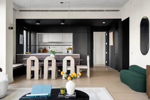 a living room with furniture and large window