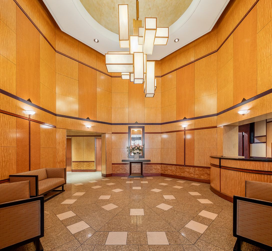 250 East 54th Street, Unit 6A Manhattan, NY 10022 - Photo 8 of 13 a view of a garage with wooden floor and iron stairs