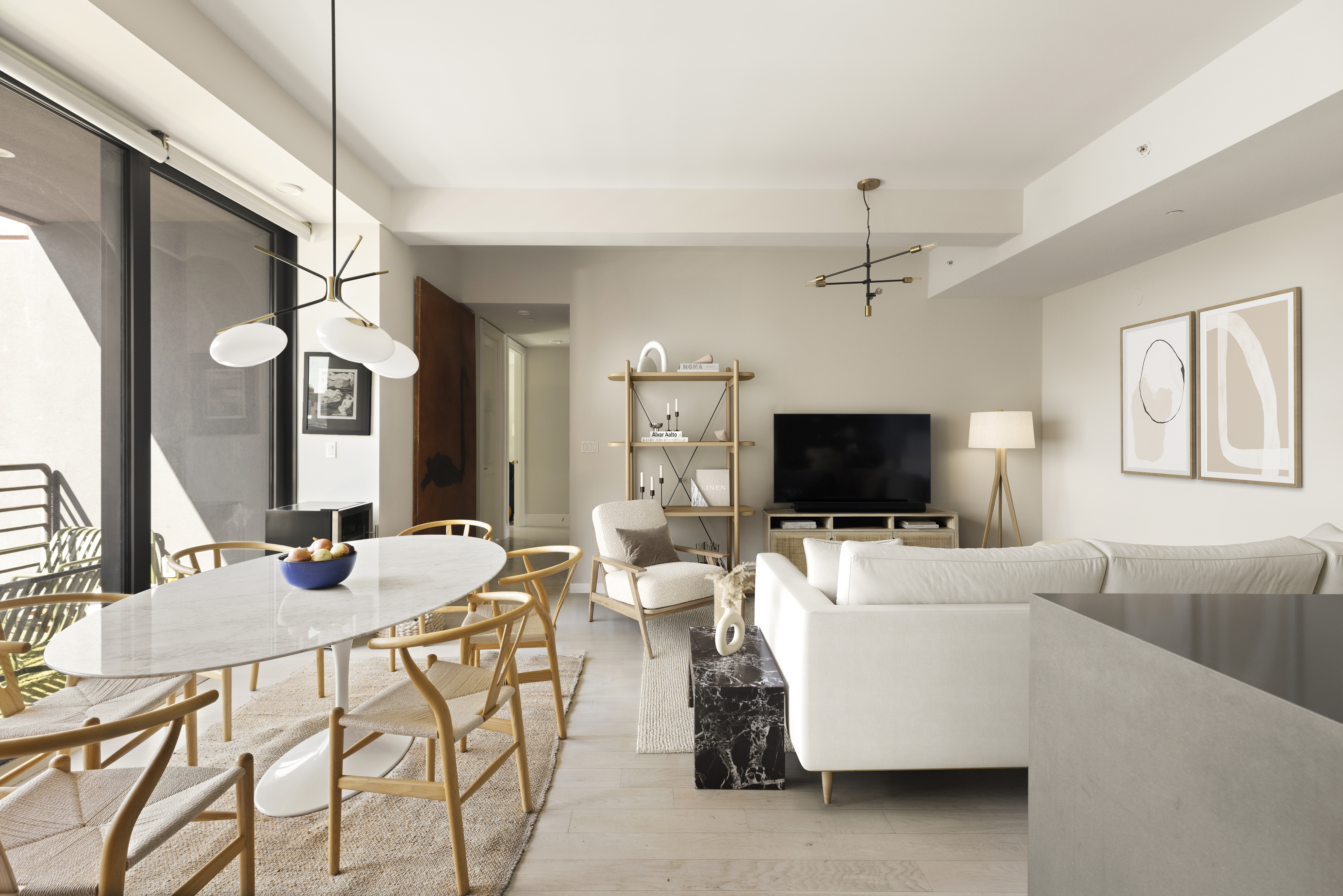 170 South 1st Street, Unit 4B Brooklyn, NY 11211 - Photo 1 of 11 a living room with furniture and a flat screen tv