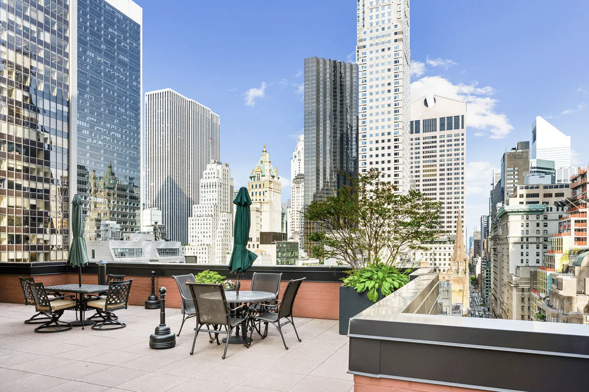 77 West 55th Street, Unit 11G Manhattan, NY 10019 - Photo 8 of 12 a view of balcony with chairs and bench