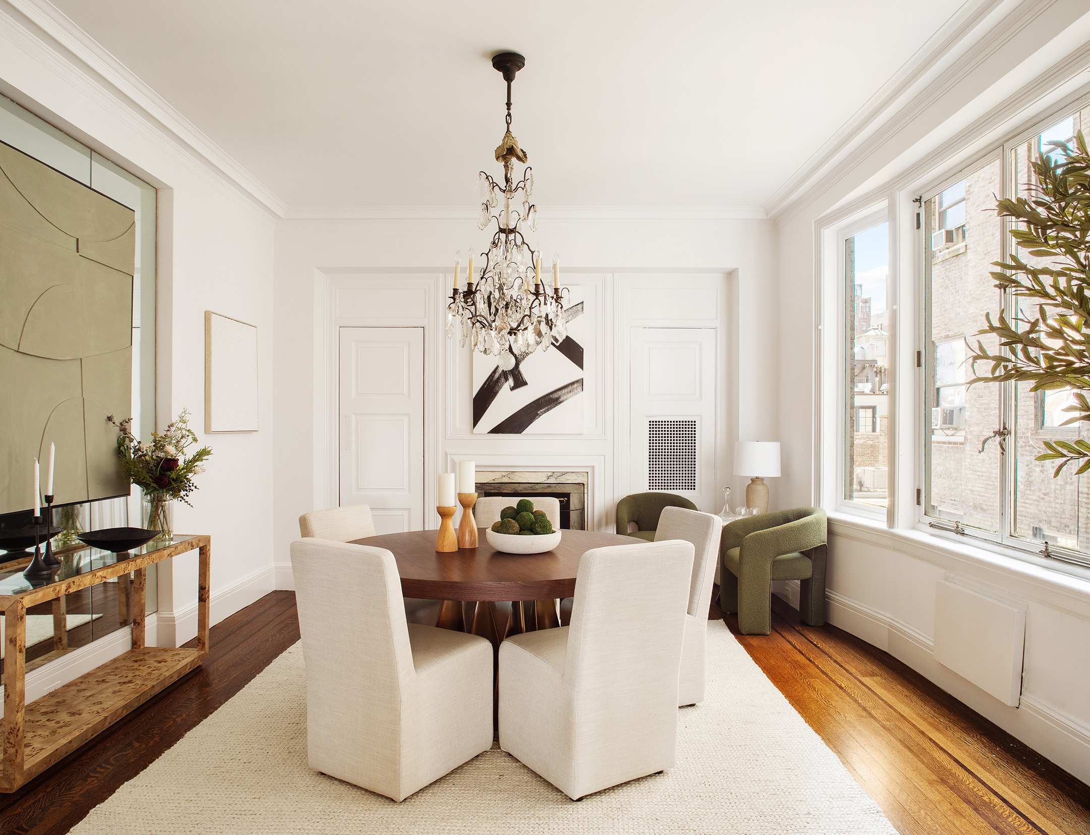 953 5th Avenue, Unit 7/8 Manhattan, NY 10075 - Photo 5 of 15 a living room with furniture a large window and a chandelier