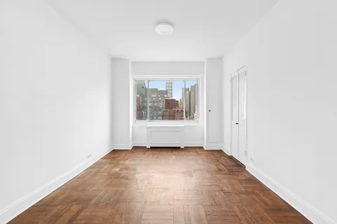 a view of an empty room with a window