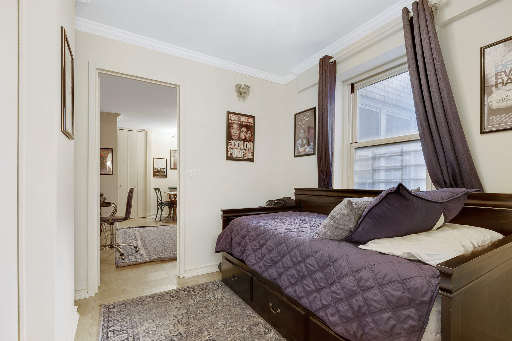 159 West 53rd Street, Unit 18A Manhattan, NY 10019 - Photo 6 of 8 a bedroom with a bed and a couch