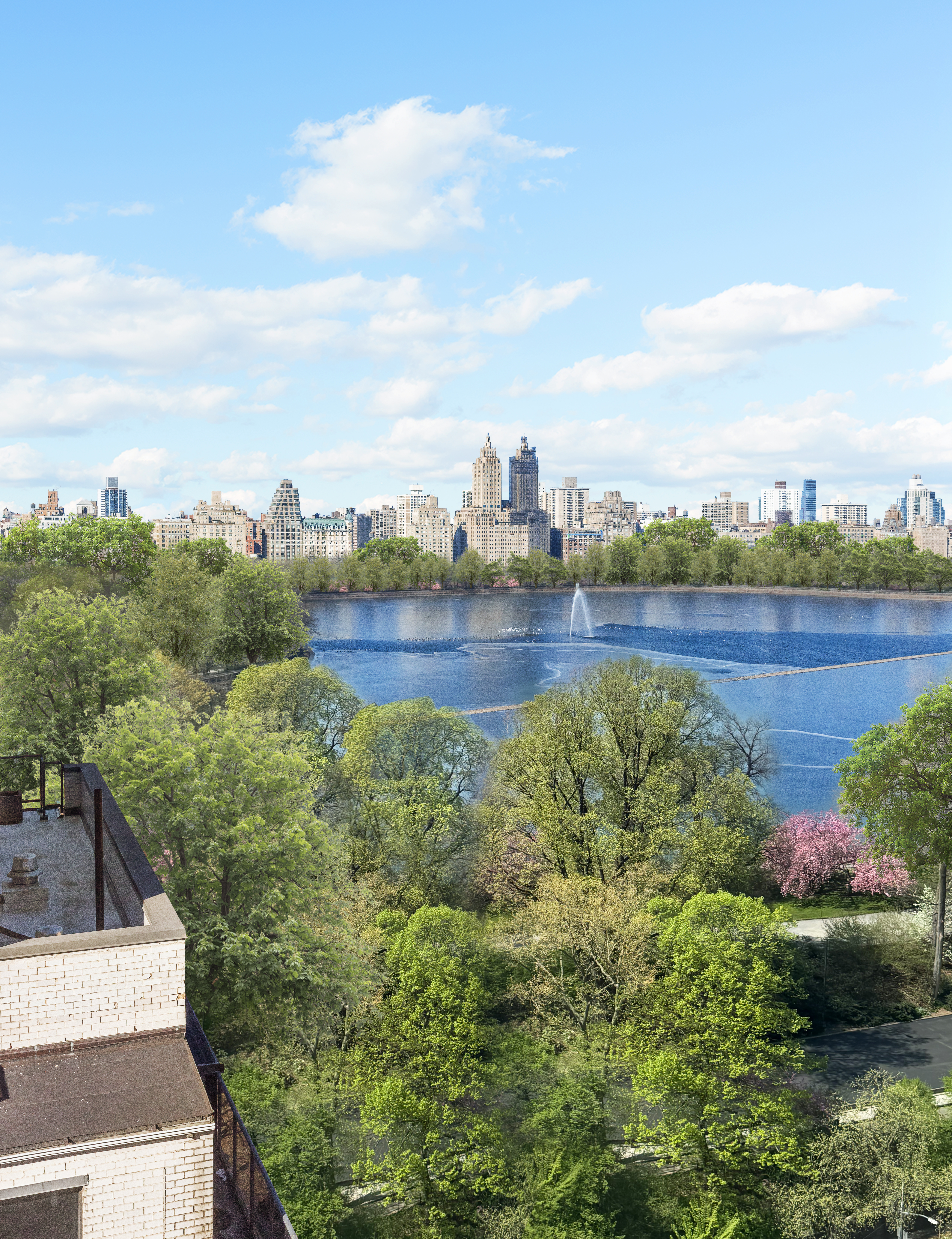 1049 5th Avenue, Unit 17A Manhattan, NY 10028 - Photo 6 of 11 a view of a lake with houses in the back