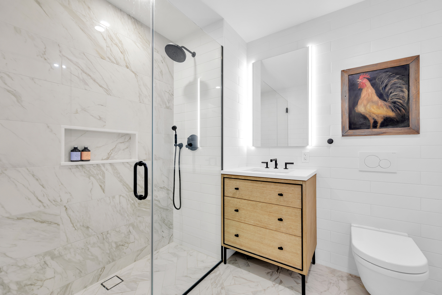 532 Clinton Avenue, Unit 5A Brooklyn, NY 11238 - Photo 6 of 11 a bathroom with a shower a sink a toilet and mirror