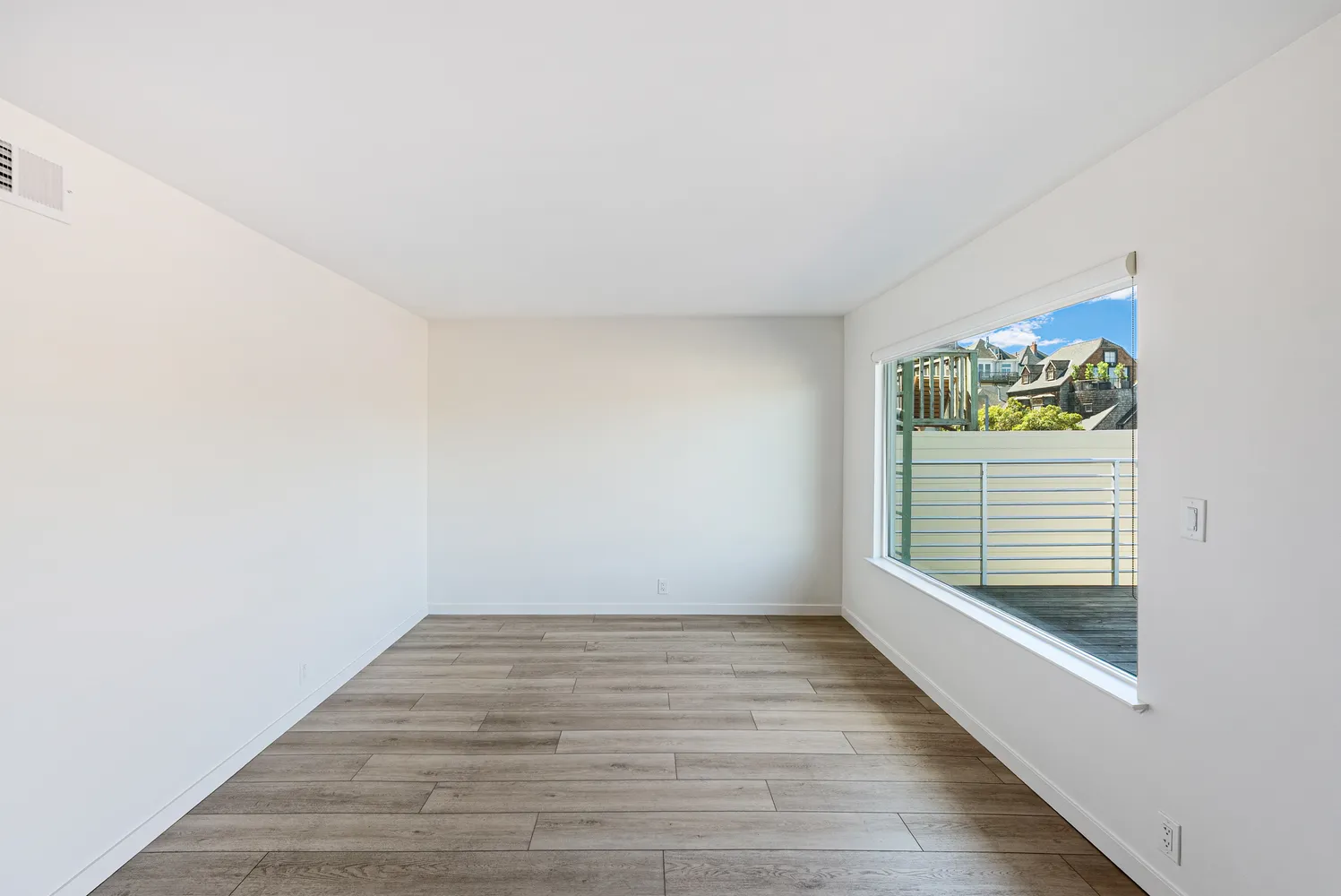 a view of an empty room with a window