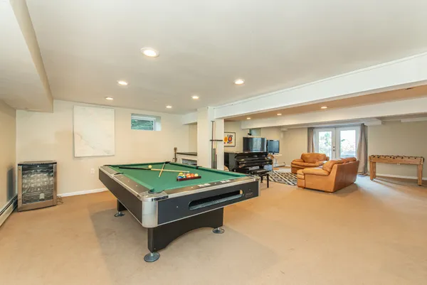 a room with furniture and pool table