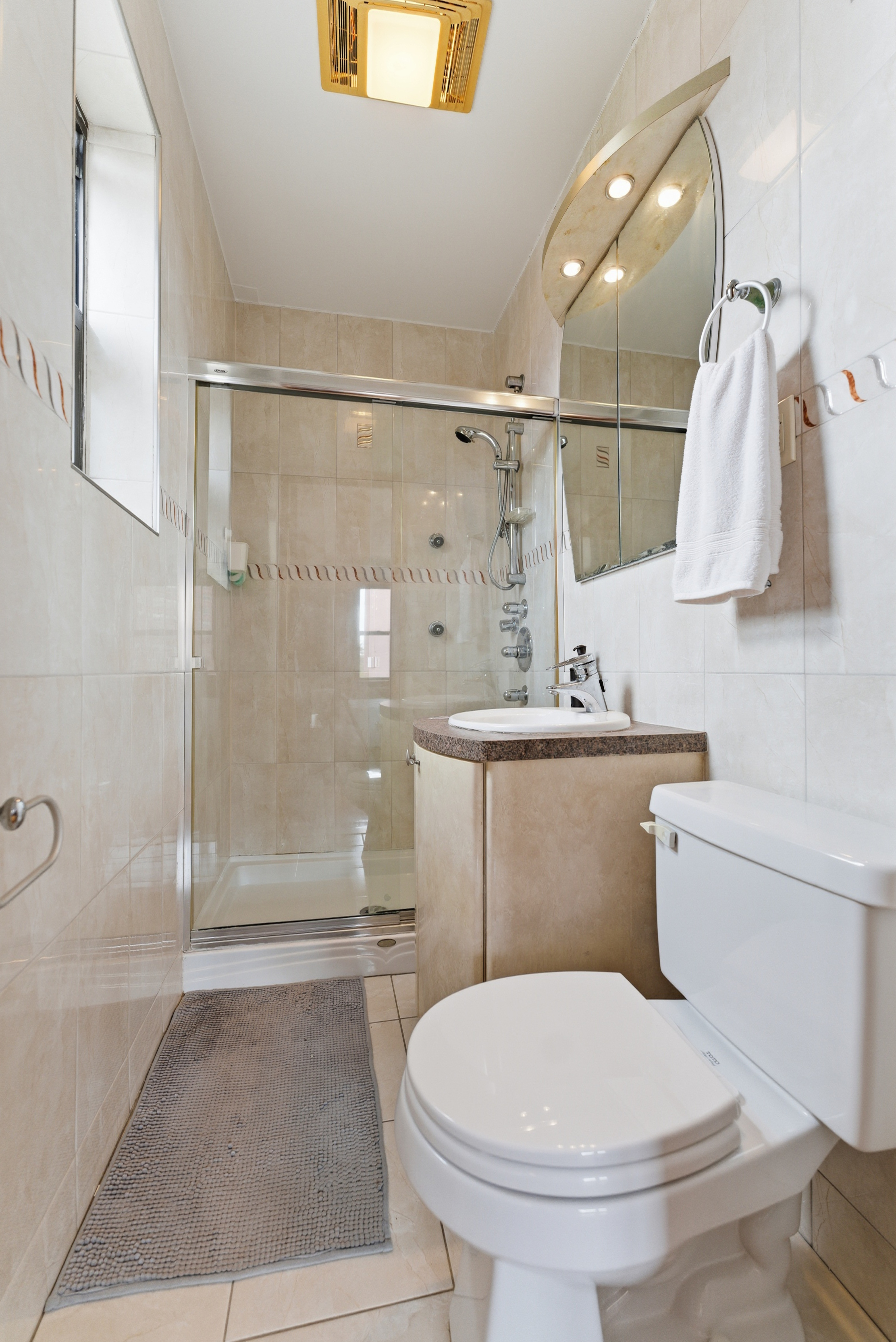 3616 Henry Hudson Parkway, Unit 7GN Bronx, NY 10463 - Photo 11 of 17 a bathroom with a toilet and a shower