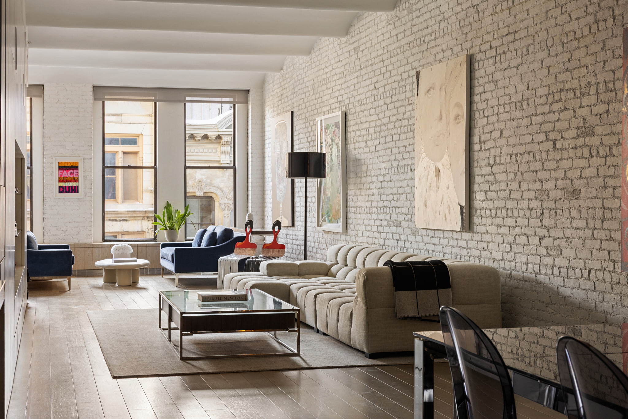 a living room with furniture and a potted plant