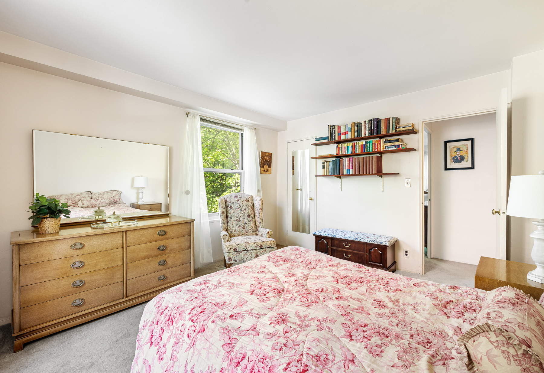 35-51 85th Street, Unit 4E Queens, NY 11372 - Photo 10 of 14 a bedroom with a bed and a dresser in it