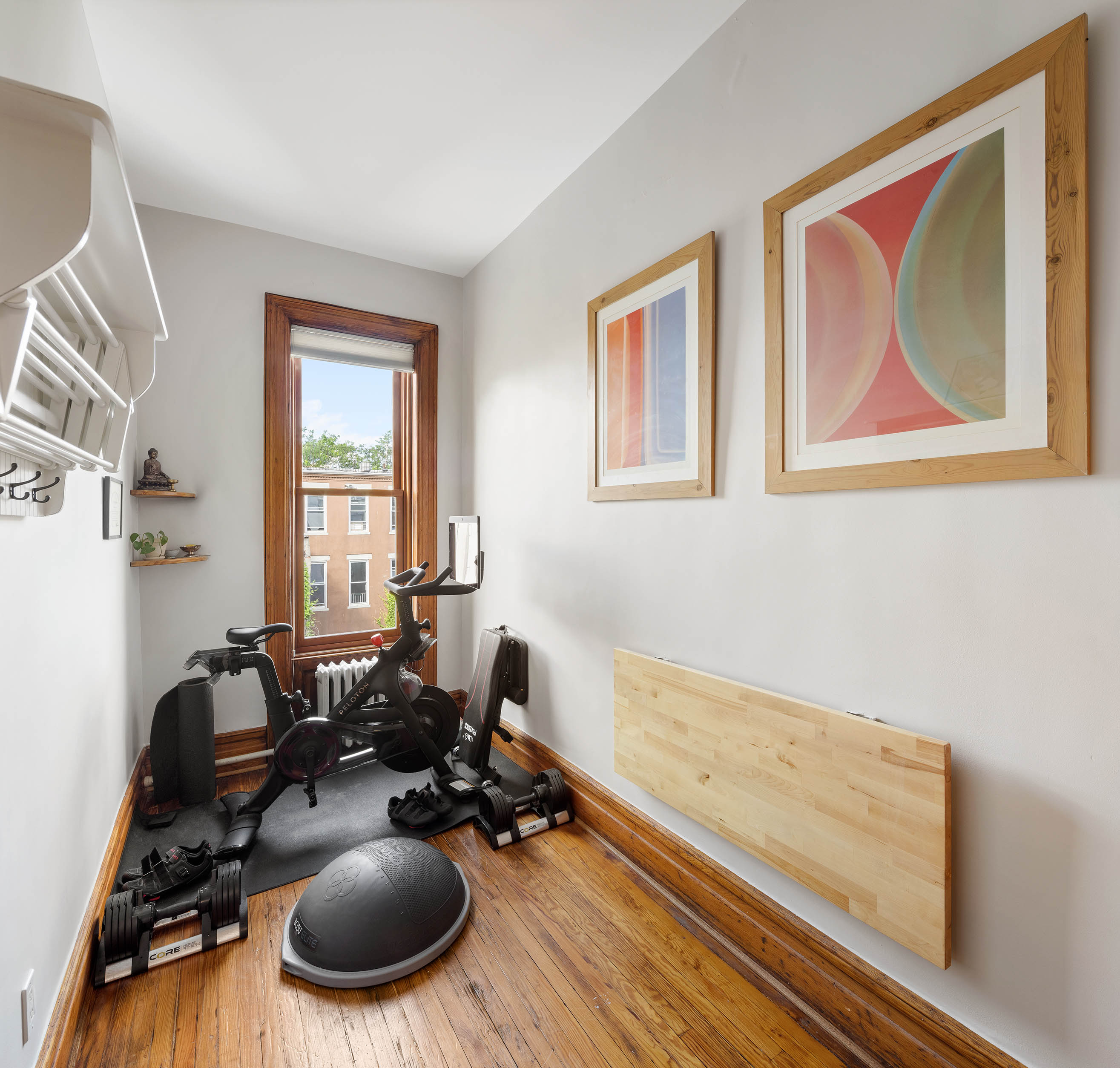 89 West 119th Street Manhattan, NY 10026 - Photo 14 of 22 a gym room with furniture and a wooden floor