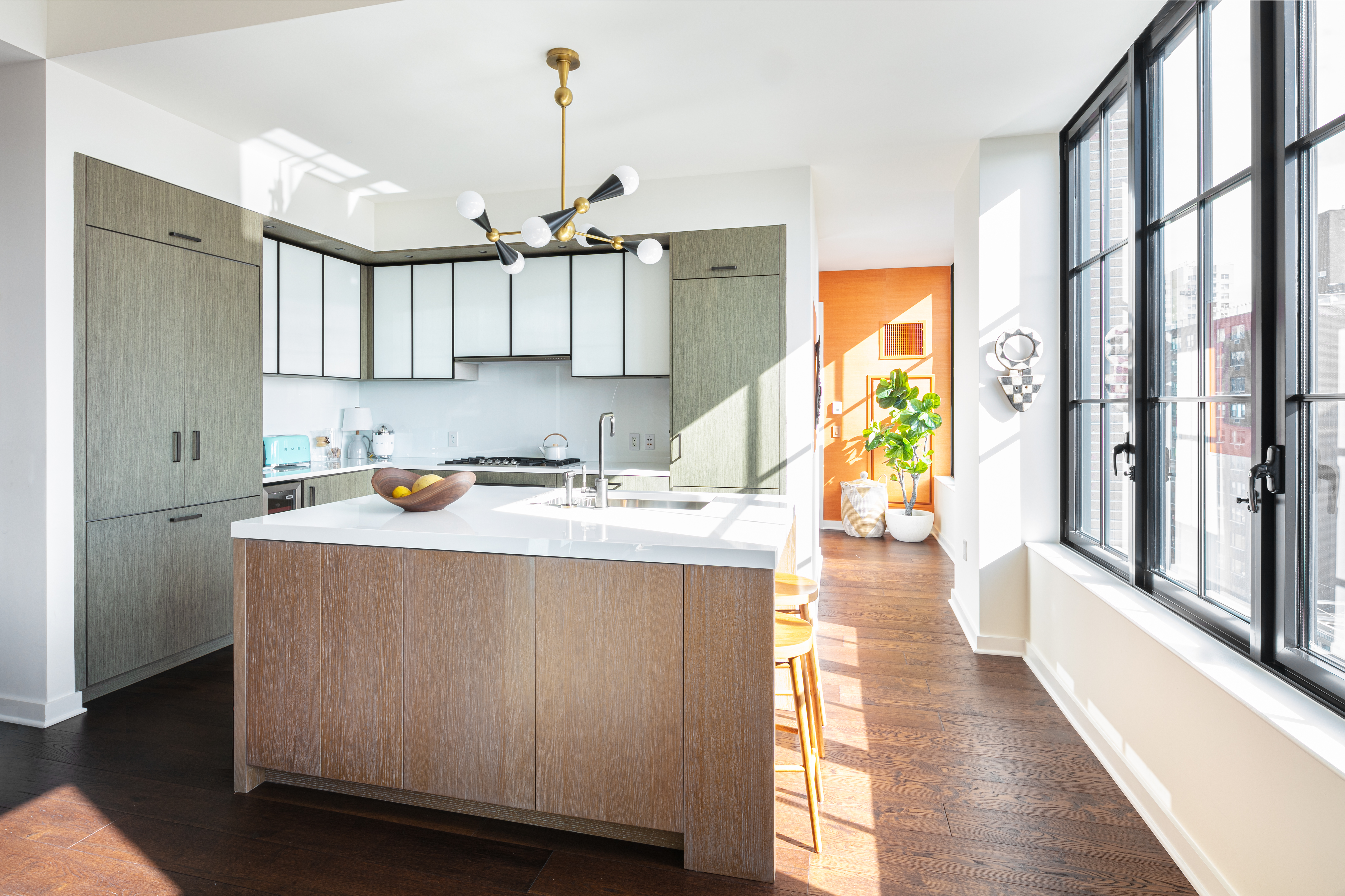 959 1st Avenue, Unit 22E Manhattan, NY 10022 - Photo 3 of 8 a kitchen with stainless steel appliances granite countertop a sink and a refrigerator