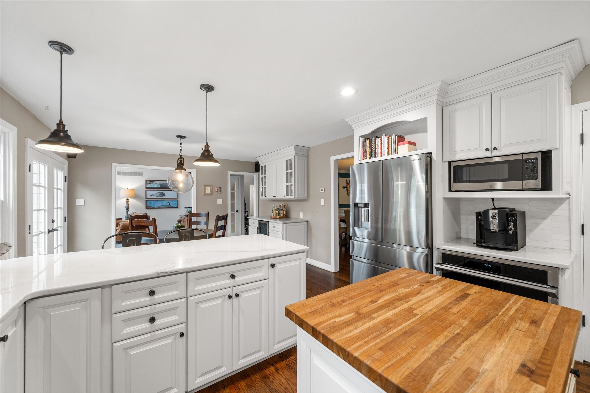 Address Upon Request West Chester, PA 19382 - Photo 15 of 76 a kitchen with stainless steel appliances kitchen island granite countertop a refrigerator a sink dishwasher a oven with white cabinets and wooden floor
