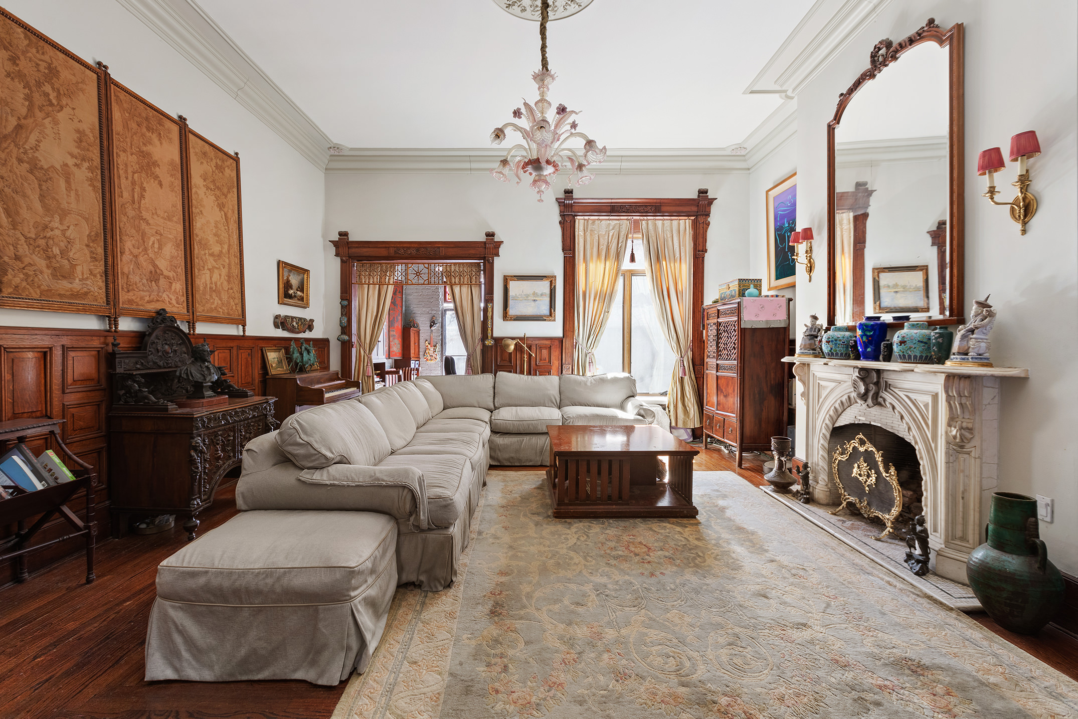 138 West 73rd Street Manhattan, NY 10023 - Photo 7 of 35 a living room with furniture large window and a fireplace
