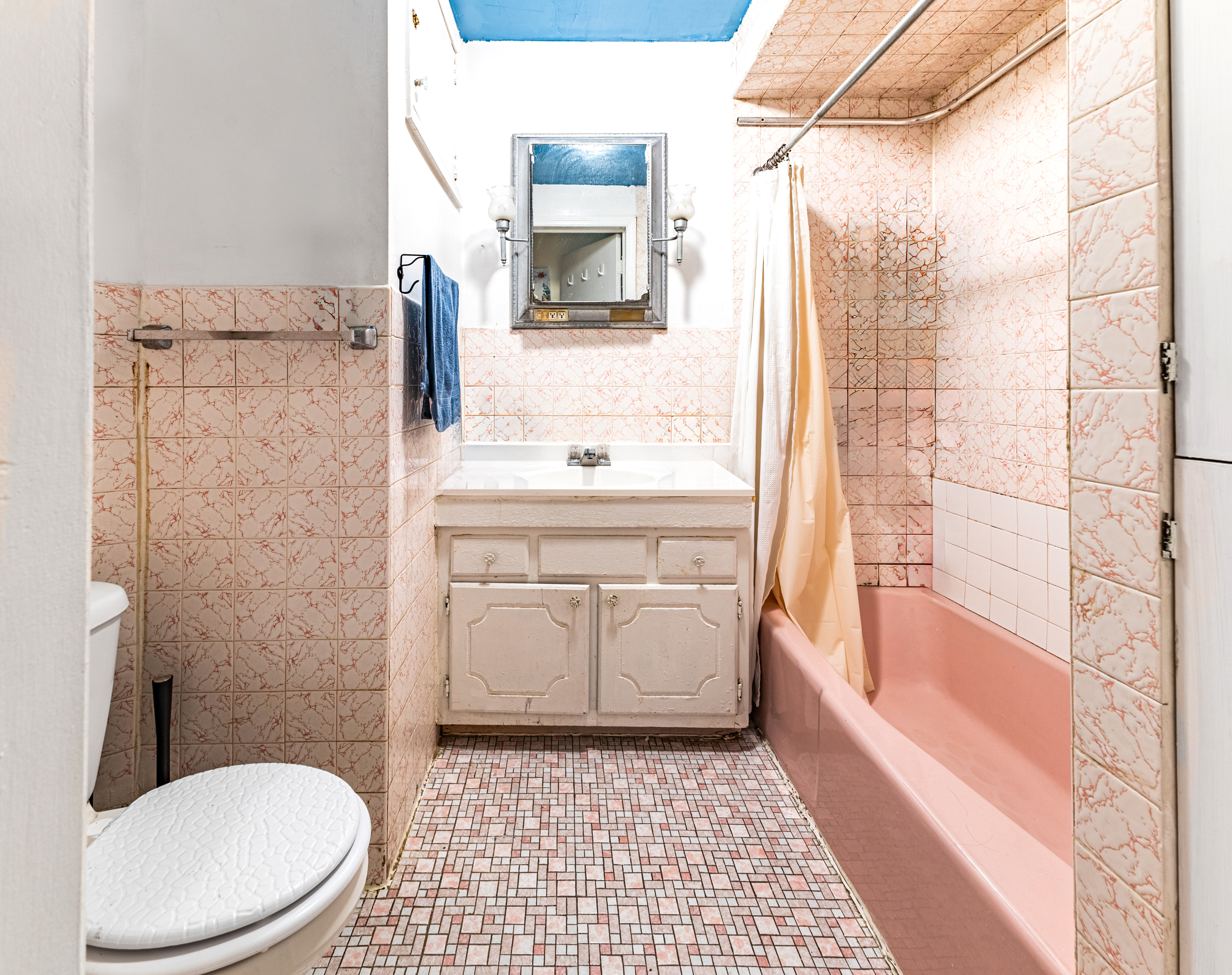 949 4th Avenue Brooklyn, NY 11232 - Photo 13 of 21 a bathroom with a sink a toilet and shower