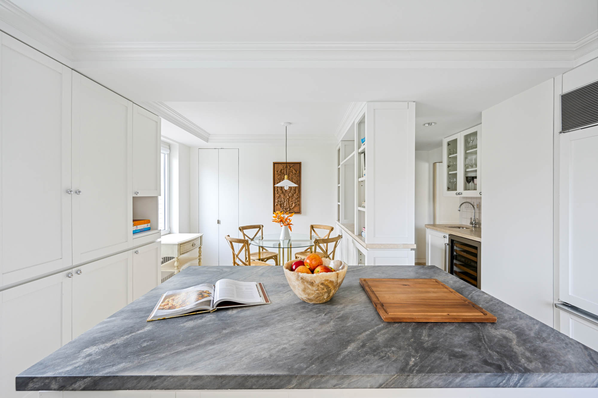 936 5th Avenue, Unit 10AB Manhattan, NY 10021 - Photo 13 of 37 a living room with furniture a rug and a fireplace
