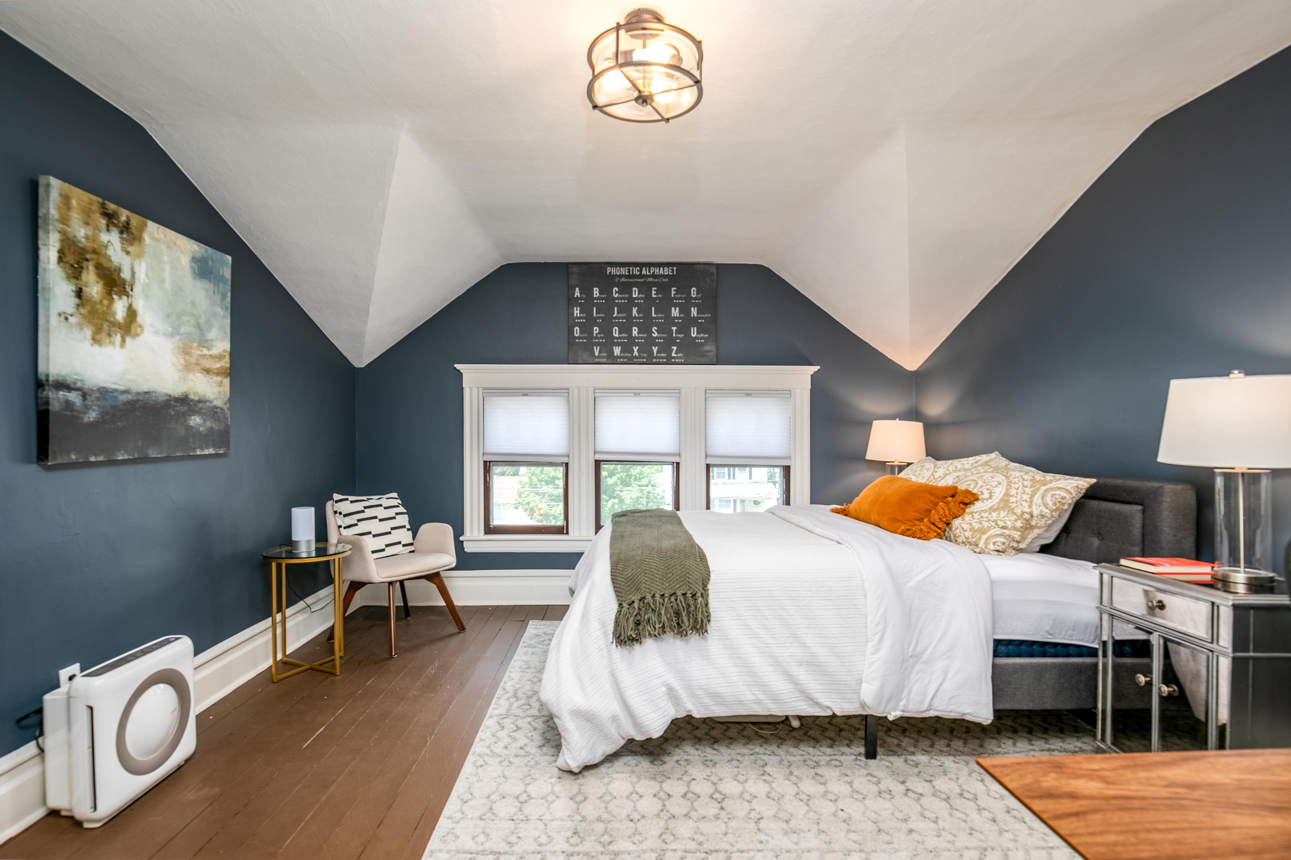 163 Ridge Road Rutherford, NJ 07070 - Photo 38 of 59 a bedroom with a bed and wooden floor