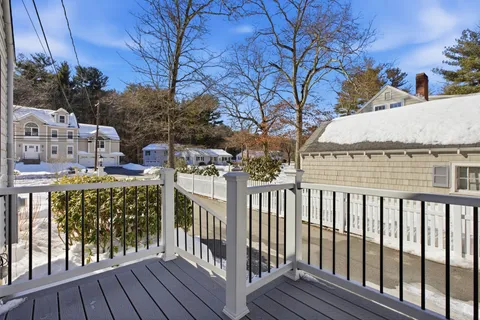 a view of a balcony with furniture