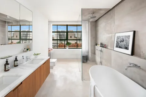 a large white kitchen with a large window
