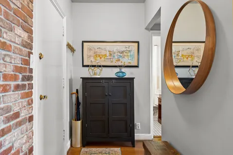 a living room with furniture dining table and a large window