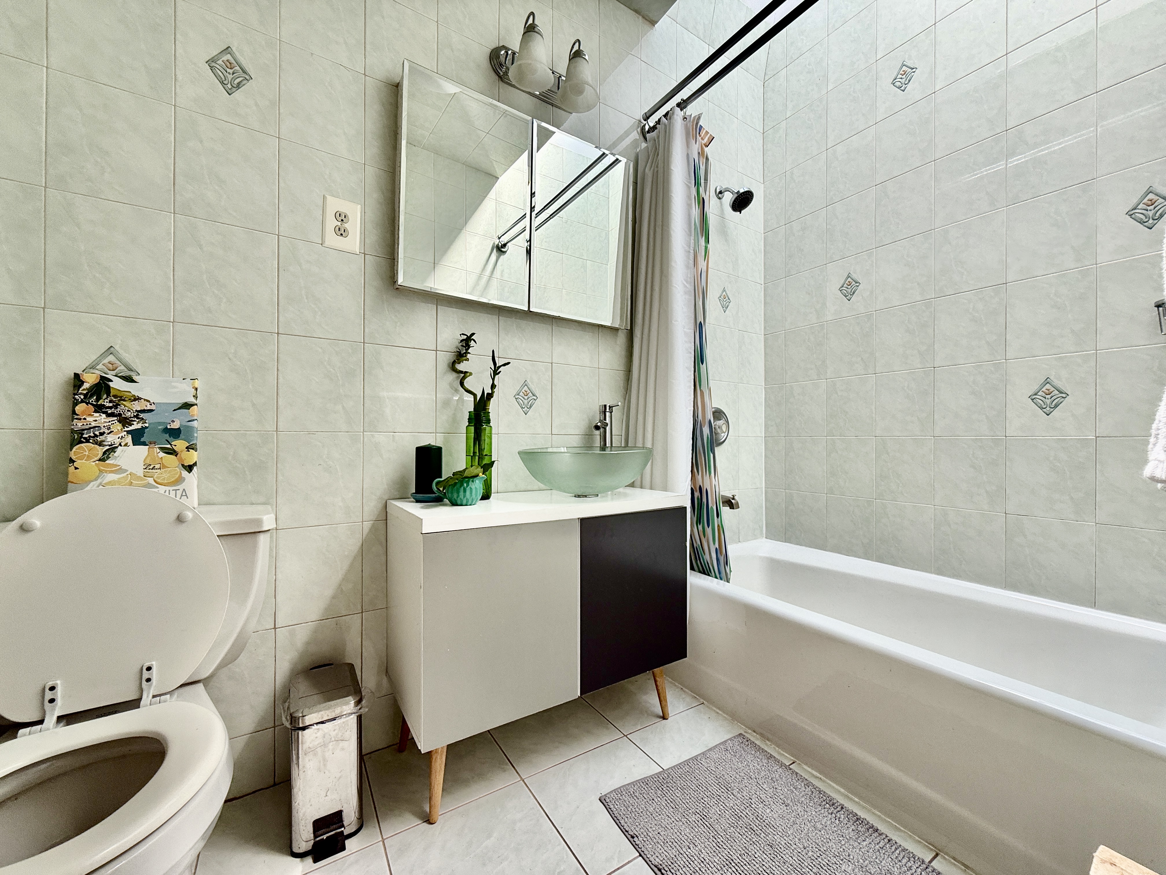 149 East 35th Street, Unit 2 Brooklyn, NY 11203 - Photo 10 of 10 a bathroom with a bathtub sink and toilet