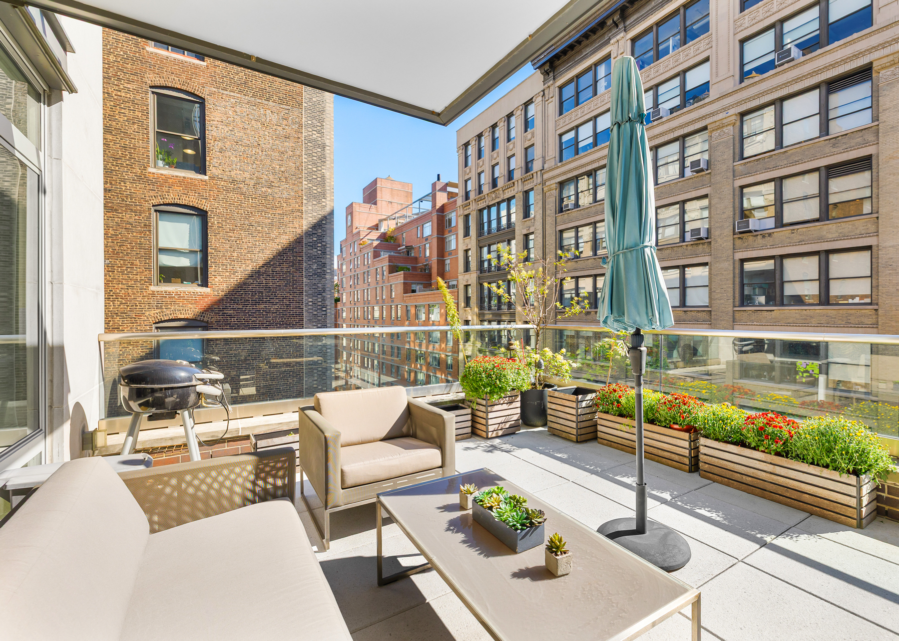 151 West 21st Street, Unit 10A Manhattan, NY 10011 - Photo 2 of 26 a view of a patio with couches table and chairs and potted plants