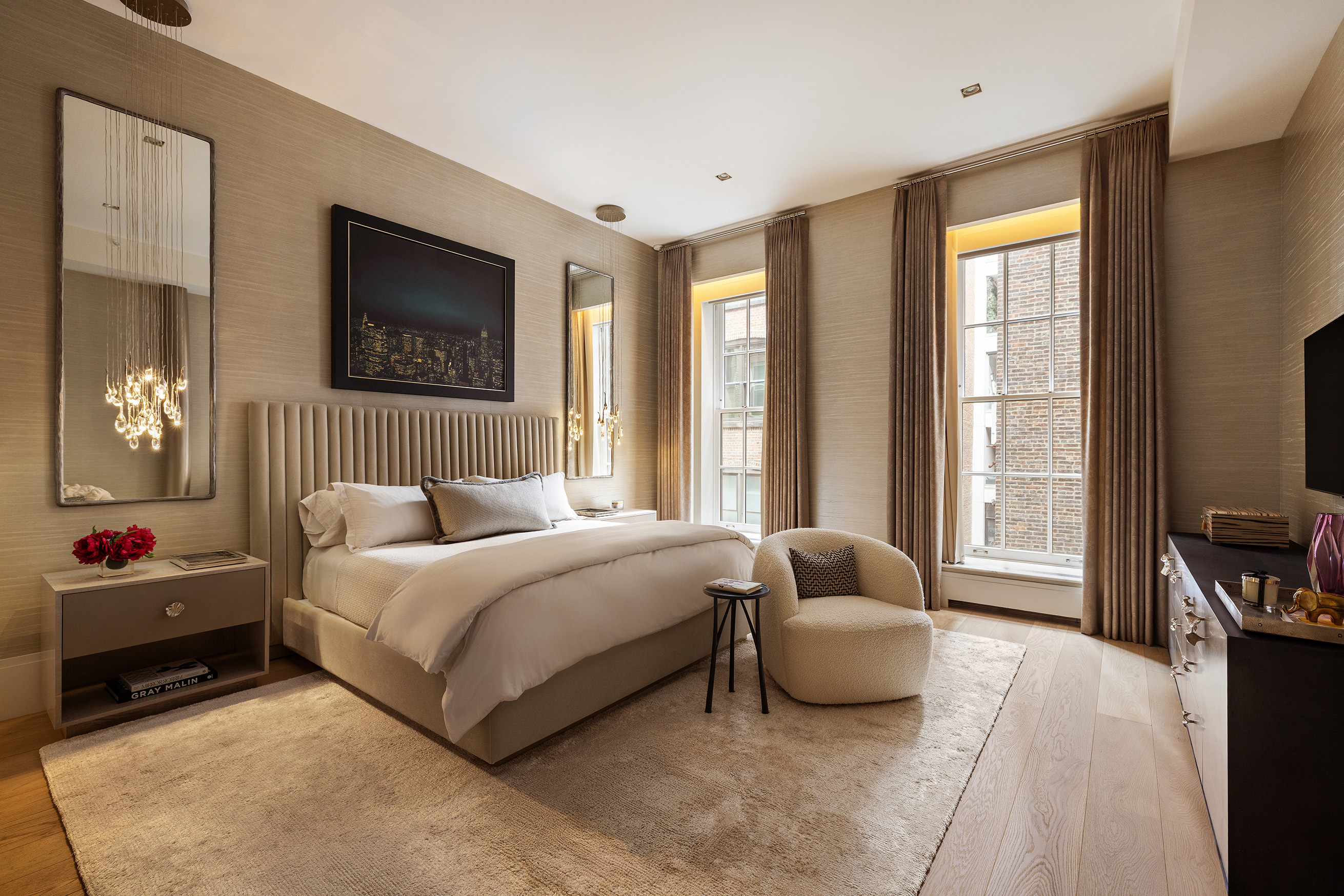 53 Greene Street, Unit 3 Manhattan, NY 10013 - Photo 12 of 22 a bedroom with a bed and glass window