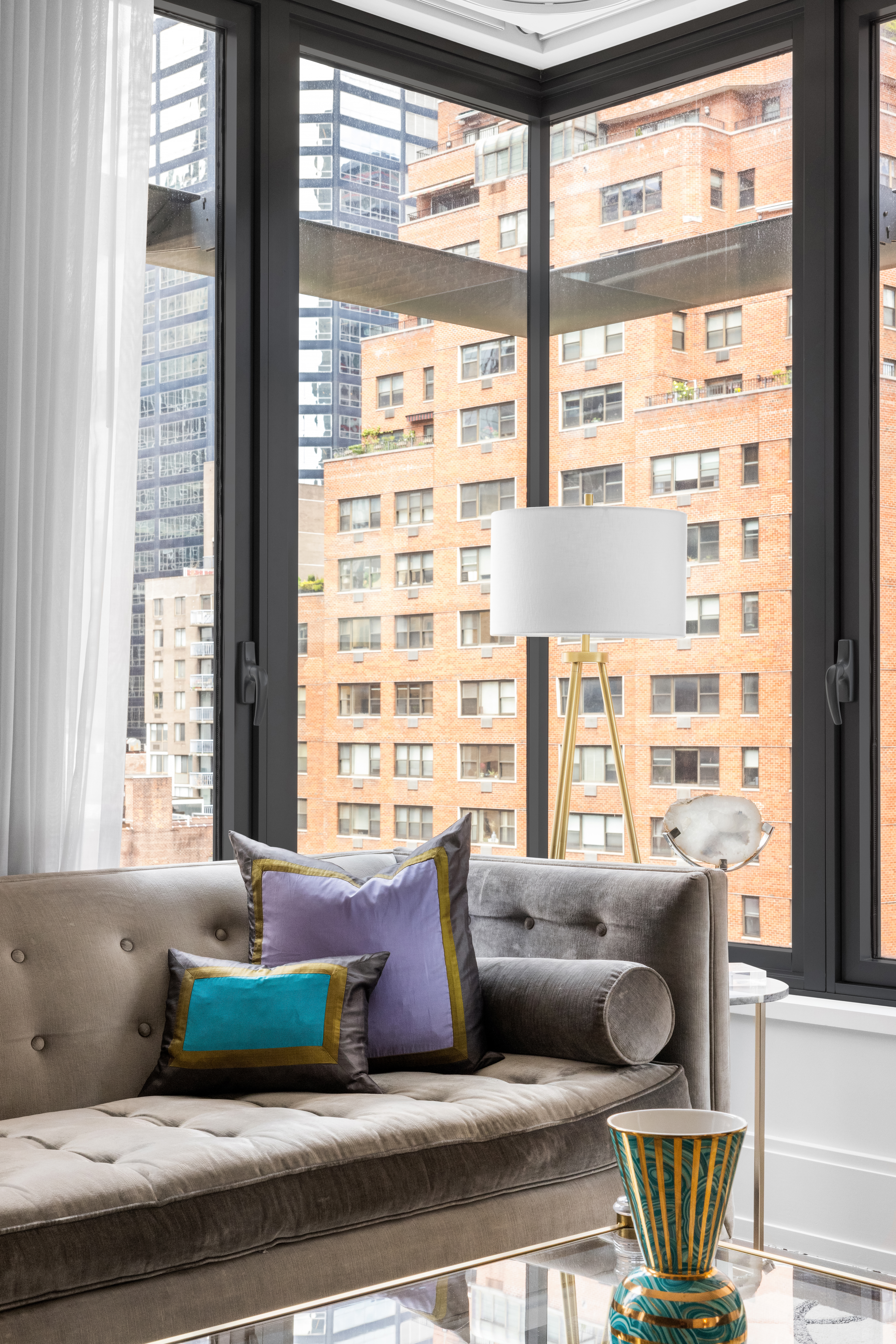 301 East 50th Street, Unit 8C Manhattan, NY 10022 - Photo 6 of 20 a living room with furniture and a window
