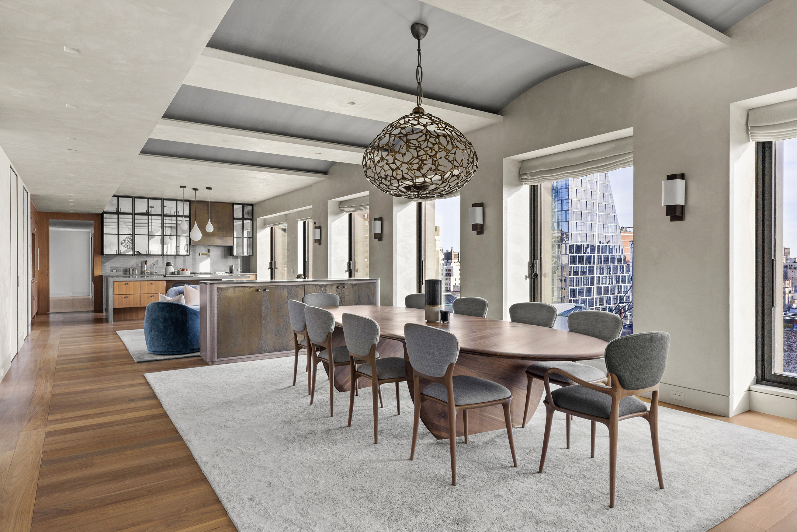 55 West 17th Street, Unit PH Manhattan, NY 10011 - Photo 6 of 36 a dining room with wooden floor a chandelier a wooden table and chairs