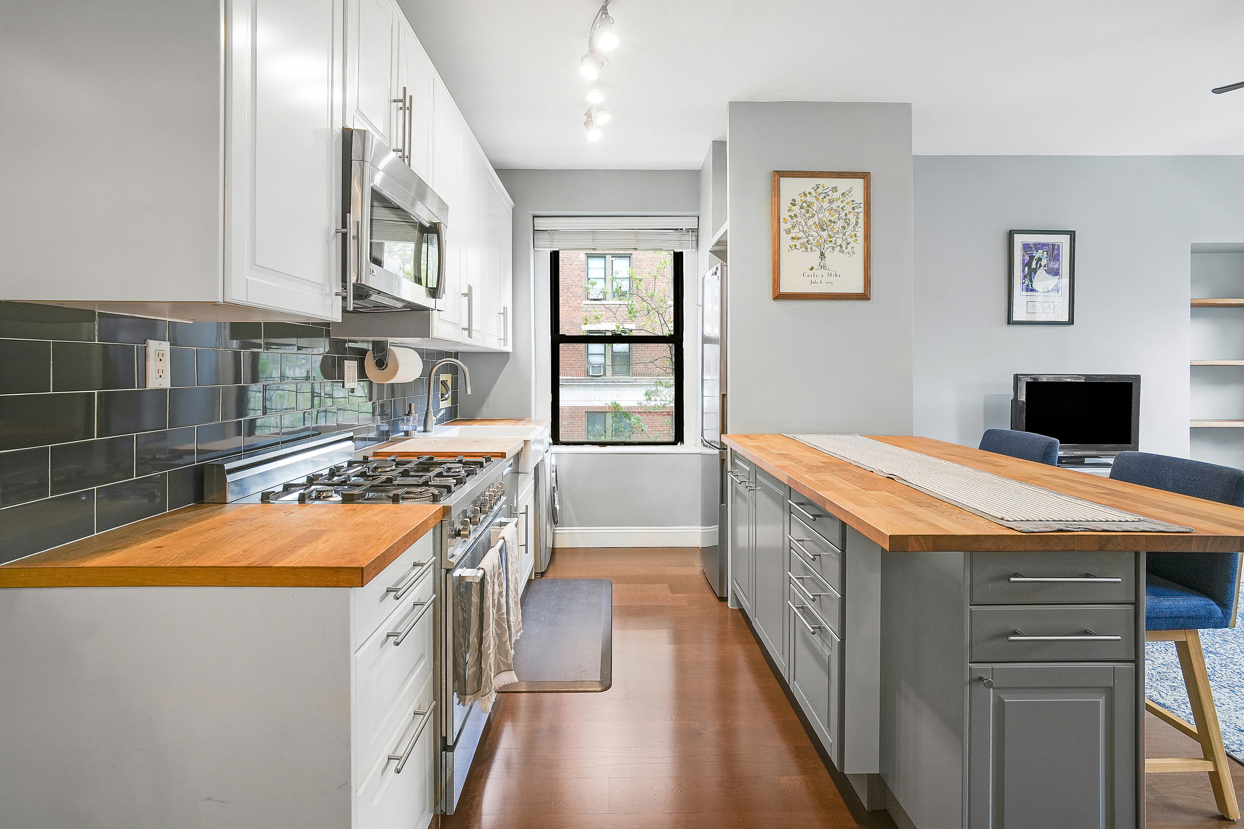 855 West End Avenue, Unit 4B Manhattan, NY 10025 - Photo 1 of 13 a kitchen with stainless steel appliances granite countertop a stove and a refrigerator
